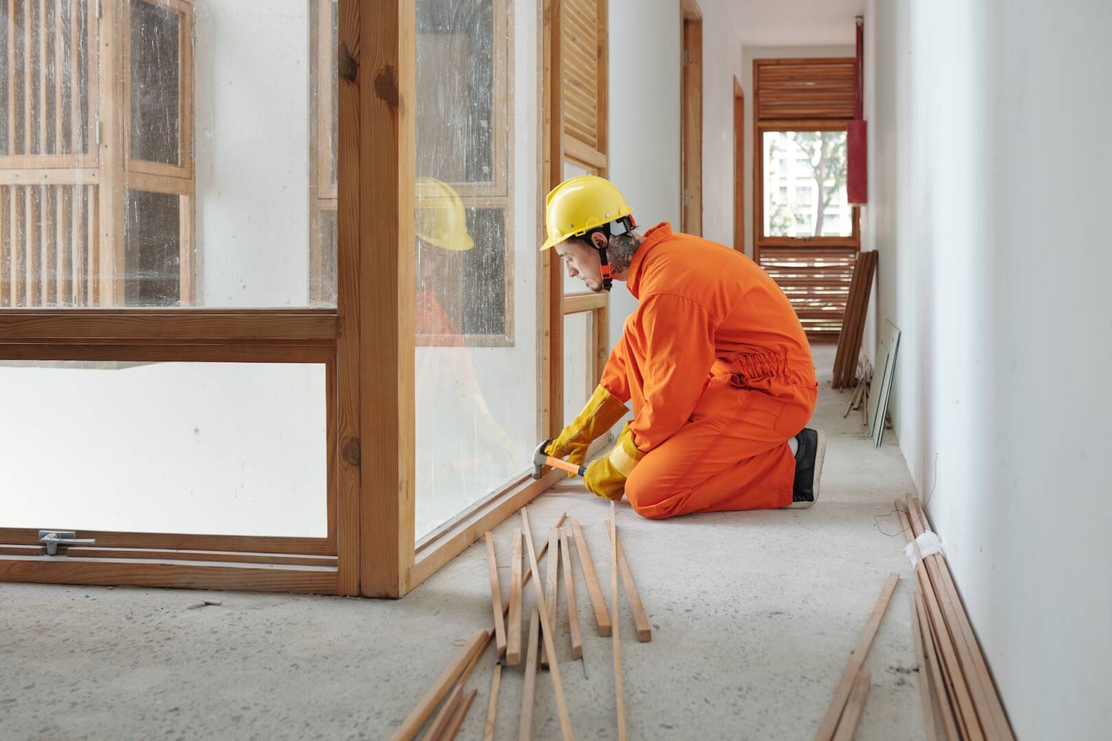 Builder Installing Wooden Window Frame
